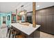 Spacious kitchen with island and dark wood cabinets at 705 Wayne Ave, New Smyrna Beach, FL 32168