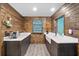 Clean kitchen with white countertops and wooden cabinetry at 705 Wayne Ave, New Smyrna Beach, FL 32168