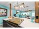 Modern kitchen island with wooden cutting board and seating at 705 Wayne Ave, New Smyrna Beach, FL 32168