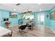 Bright living area with teal walls and comfortable seating at 705 Wayne Ave, New Smyrna Beach, FL 32168