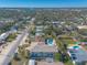 Aerial view showing house, pool, and neighborhood at 708 Ocean Ave, New Smyrna Beach, FL 32169