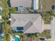 Aerial view of home's roof, pool, and driveway at 708 Ocean Ave, New Smyrna Beach, FL 32169