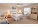 Bright bedroom with a white wicker bed frame and a neutral color scheme at 708 Ocean Ave, New Smyrna Beach, FL 32169