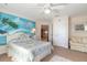 Peaceful bedroom with a double bed and tropical wall mural at 708 Ocean Ave, New Smyrna Beach, FL 32169