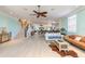 Open living space with hardwood floors and a view of the kitchen at 708 Ocean Ave, New Smyrna Beach, FL 32169