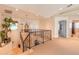 Upstairs hallway with chandelier, carpet, and railing at 708 Ocean Ave, New Smyrna Beach, FL 32169