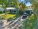 Aerial view of a ranch home with a driveway and a neatly kept yard at 729 N Flamingo Dr, Daytona Beach, FL 32117