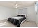 Bright bedroom featuring a ceiling fan and large bed at 729 N Flamingo Dr, Daytona Beach, FL 32117