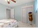 Light and airy bedroom with double doors leading to a closet at 729 N Flamingo Dr, Daytona Beach, FL 32117