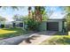 House exterior with a dark brown garage door at 729 N Flamingo Dr, Daytona Beach, FL 32117