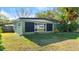 House exterior with a green wall and yellow chair at 729 N Flamingo Dr, Daytona Beach, FL 32117