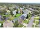 Aerial view of a house with a gray roof and a large backyard at 813 Pine Shores Cir, New Smyrna Beach, FL 32168