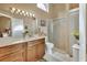 Clean bathroom with a shower/tub combo, double vanity, and linen closet at 813 Pine Shores Cir, New Smyrna Beach, FL 32168