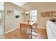 Dining area with hardwood floors, a small wooden table, and a built in window seat at 813 Pine Shores Cir, New Smyrna Beach, FL 32168