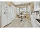 Kitchen with white cabinets, granite countertops, and a breakfast nook at 813 Pine Shores Cir, New Smyrna Beach, FL 32168