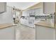 Kitchen with white cabinets, granite countertops, and a tile backsplash at 813 Pine Shores Cir, New Smyrna Beach, FL 32168