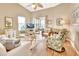 Living room with hardwood floors, comfy seating, and access to a screened porch at 813 Pine Shores Cir, New Smyrna Beach, FL 32168