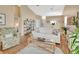 Living room with hardwood floors, white couch, and a view into the kitchen at 813 Pine Shores Cir, New Smyrna Beach, FL 32168