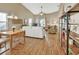 Bright living room with hardwood floors, white couch, and built in shelving at 813 Pine Shores Cir, New Smyrna Beach, FL 32168