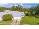 Aerial view of house, two-car garage, and surrounding lawn at 933 Meadow View Dr # D, Port Orange, FL 32127