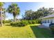 Backyard with lush landscaping and patio area at 933 Meadow View Dr # D, Port Orange, FL 32127