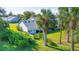 Single story home with backyard, palm trees, and patio at 933 Meadow View Dr # D, Port Orange, FL 32127