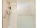 Walk-in shower with grab bars and glass door at 933 Meadow View Dr # D, Port Orange, FL 32127