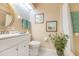 Clean bathroom with white vanity, toilet and shower/tub combo at 933 Meadow View Dr # D, Port Orange, FL 32127