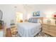 Bedroom with queen bed, dresser and access to bathroom at 933 Meadow View Dr # D, Port Orange, FL 32127