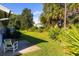 Backyard patio with chair, lush greenery, and privacy at 933 Meadow View Dr # D, Port Orange, FL 32127