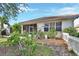 Landscaped backyard with white picket fence at 987 Mori Ct, Port Orange, FL 32127