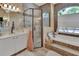 Bathroom with soaking tub, walk-in shower, and updated vanity at 987 Mori Ct, Port Orange, FL 32127
