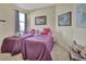 Cozy bedroom with twin beds and neutral decor at 987 Mori Ct, Port Orange, FL 32127