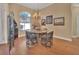 Elegant dining room with a round table and wicker chairs at 987 Mori Ct, Port Orange, FL 32127