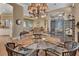 Open dining room with glass table and view into the living room at 987 Mori Ct, Port Orange, FL 32127