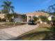 One-story home with tile roof, driveway, and lush landscaping at 987 Mori Ct, Port Orange, FL 32127