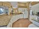 Kitchen boasts granite countertops and white cabinetry at 987 Mori Ct, Port Orange, FL 32127