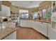 Spacious kitchen with granite countertops and white cabinets at 987 Mori Ct, Port Orange, FL 32127