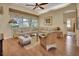 Spacious living room with beige sectional sofa and wood floors at 987 Mori Ct, Port Orange, FL 32127