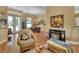 Living area with hardwood floors, fireplace, and access to backyard at 987 Mori Ct, Port Orange, FL 32127