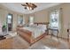 Spacious main bedroom with a large wicker bed and plenty of natural light at 987 Mori Ct, Port Orange, FL 32127