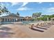 Community pool with lounge chairs and clubhouse at 987 Mori Ct, Port Orange, FL 32127