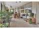 Relaxing screened porch with seating area and grill at 987 Mori Ct, Port Orange, FL 32127