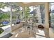Screened porch with patio furniture and view of backyard at 987 Mori Ct, Port Orange, FL 32127