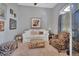 Cozy sitting room with a white couch and patterned armchairs at 987 Mori Ct, Port Orange, FL 32127