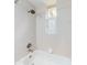 Bathroom with a shower/tub combo and a window at 1004 Flying M Ct, Edgewater, FL 32132