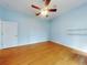 Charming bedroom with wood floors and a ceiling fan at 1004 Flying M Ct, Edgewater, FL 32132