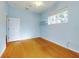 Light and airy bedroom with wood floors and a ceiling fan at 1004 Flying M Ct, Edgewater, FL 32132