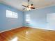 Bright bedroom with hardwood floors, ceiling fan, and a window with natural light at 1004 Flying M Ct, Edgewater, FL 32132