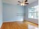 Spacious bedroom with wood floors and a ceiling fan at 1004 Flying M Ct, Edgewater, FL 32132